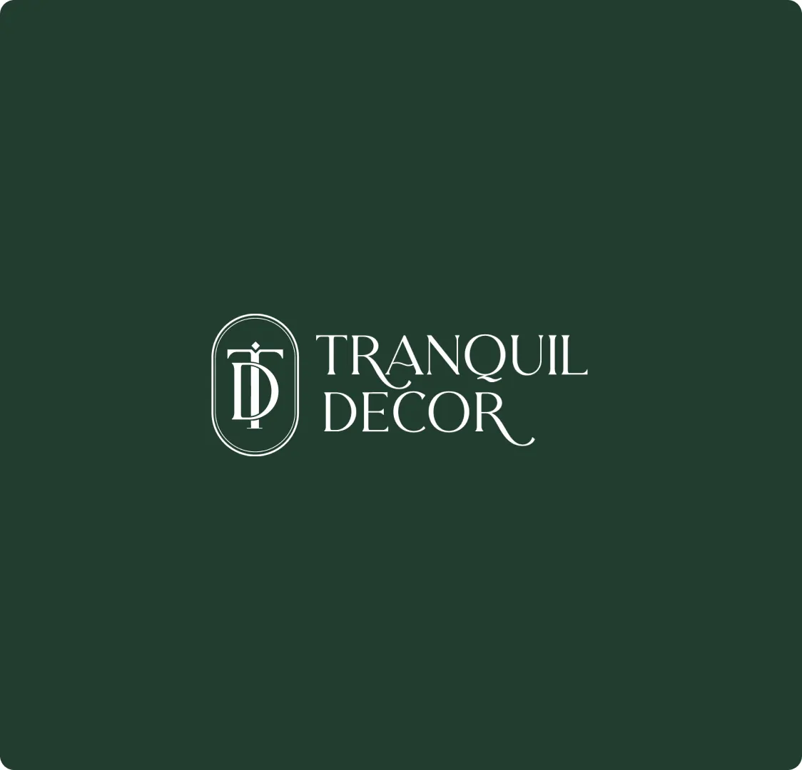 The Tranquil Decor monogram and wordmark in white on a dark green background.