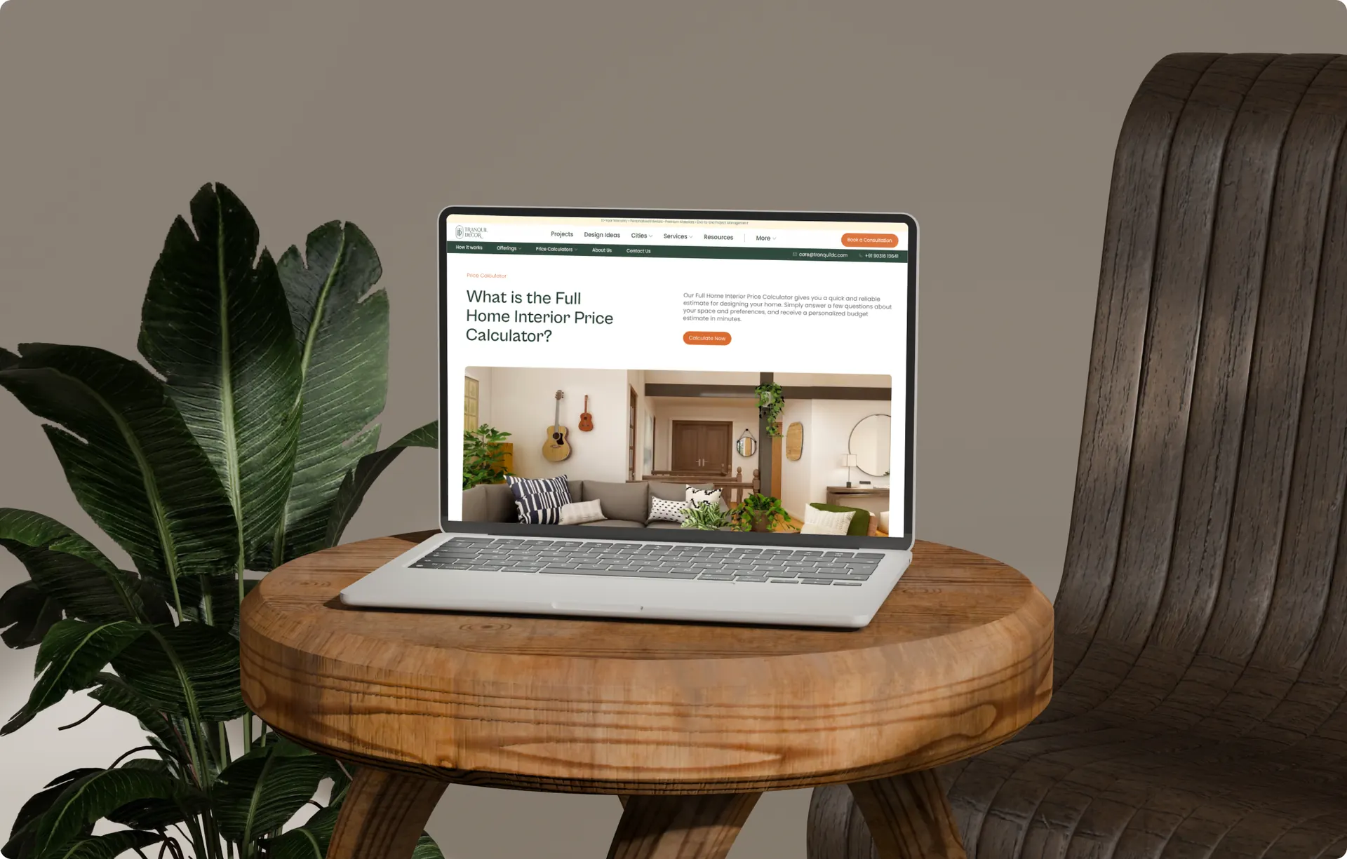 A laptop on a wooden side table showing the Tranquil Decor price calculator page with the full two-row navigation and the contact bar above it.