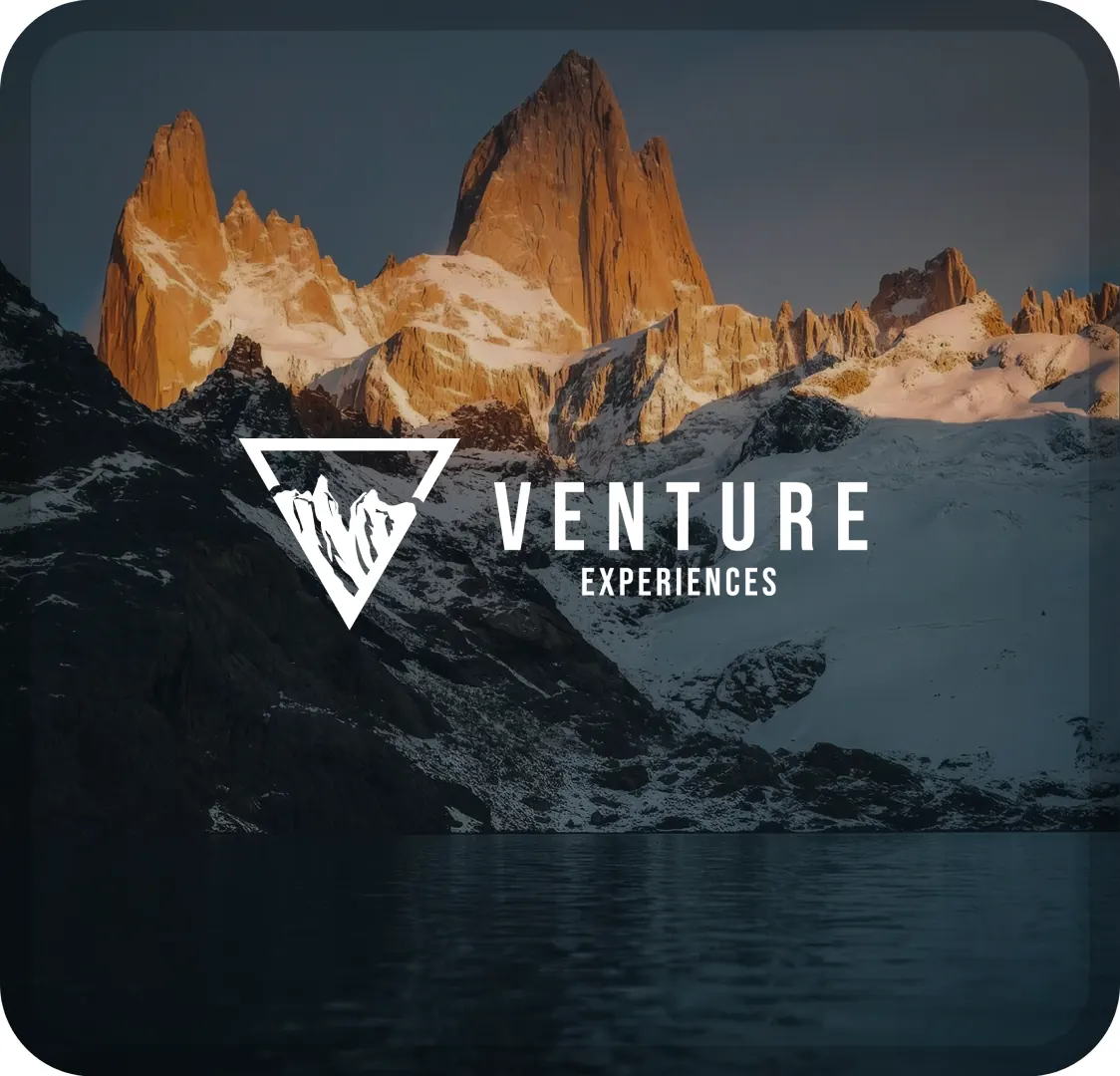 The Venture Experiences logo in white over a dark photograph of a mountain range above a lake.